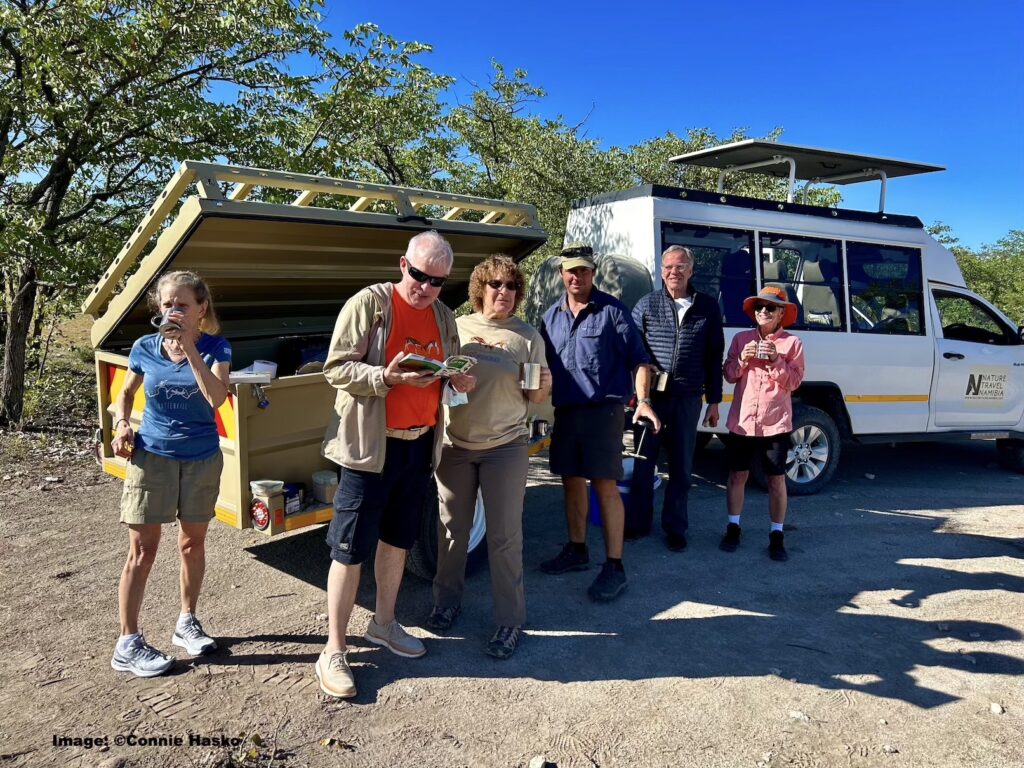 Coffee Break! Kathy, John, Penny, Marc, Hugh and Jane. Etosha National Park.Namibia.  Image ©Connie Hasko